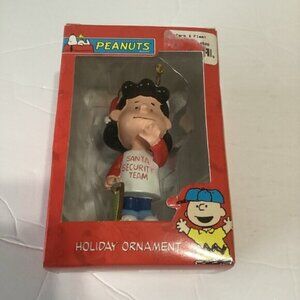Peanuts Lucy Holiday Ornament Lucy in a “Santa Security Team” T-shirt